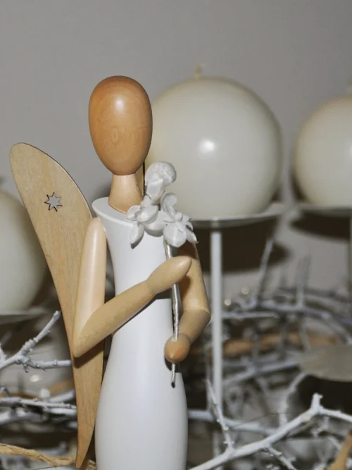 Sternkopf-Engel mit Blüte